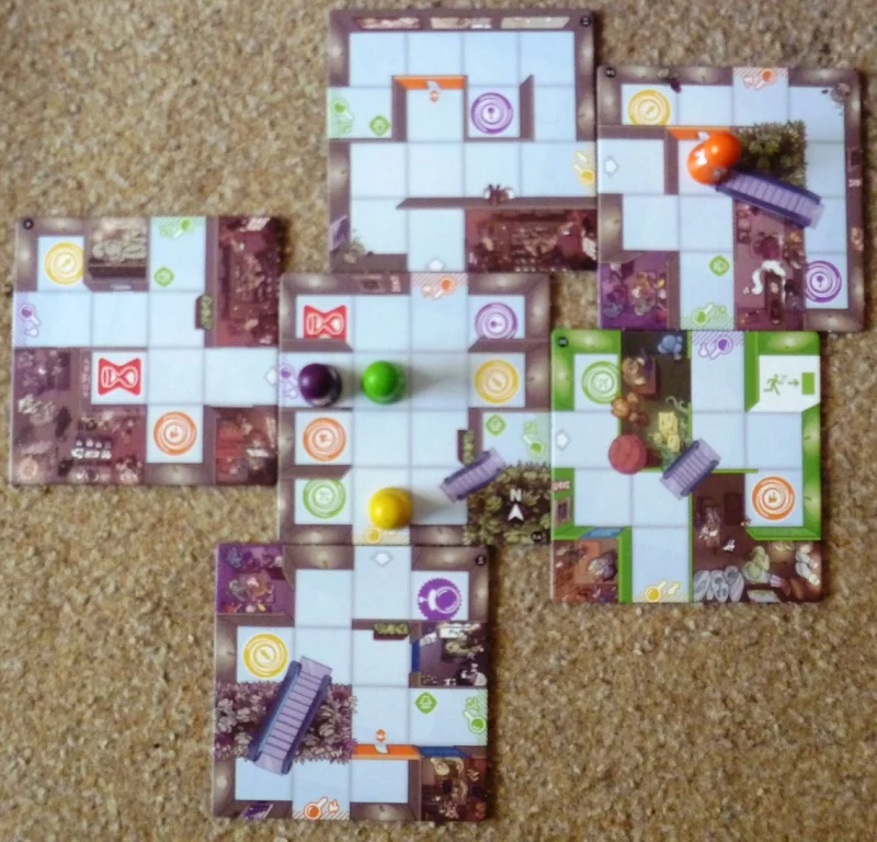 An example of the problems that can arise, Orange is needed to explore the South doorway and is waiting for a move along the escalator to the door to its North. Green is waiting for purple to move so that it can explore the North west door. yellow needs to move East than an escalator to explore further.