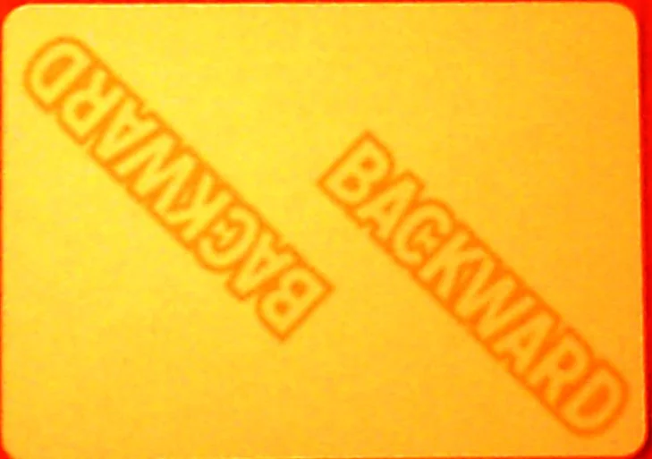 (apologies for colour) A sample card from the advanced game, a yellow BACKWARD written forwards