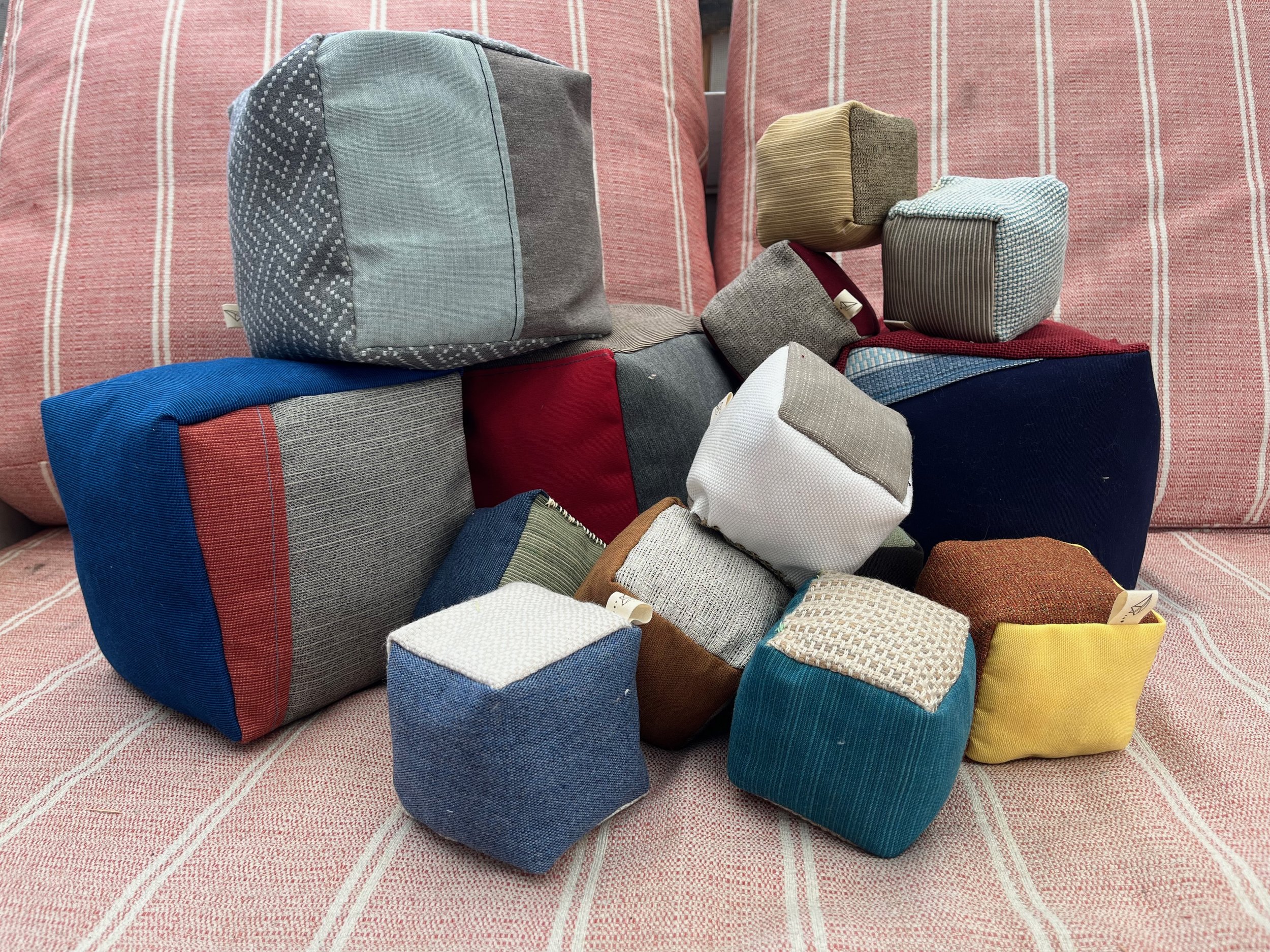  Mini &amp; bix blocks made from remnant outdoor and upholstery fabrics and stuffed with additional industrial sewing scrap.  Why?   Because it’s fun! 