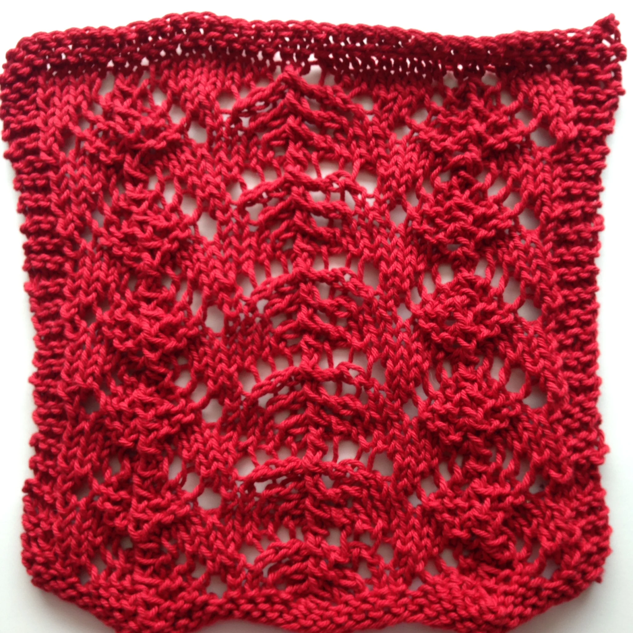 M y finished spa cloth, before blocking, "Cygnus Lace" pattern by Josie Goff, in KnitPIcks "Dishie".