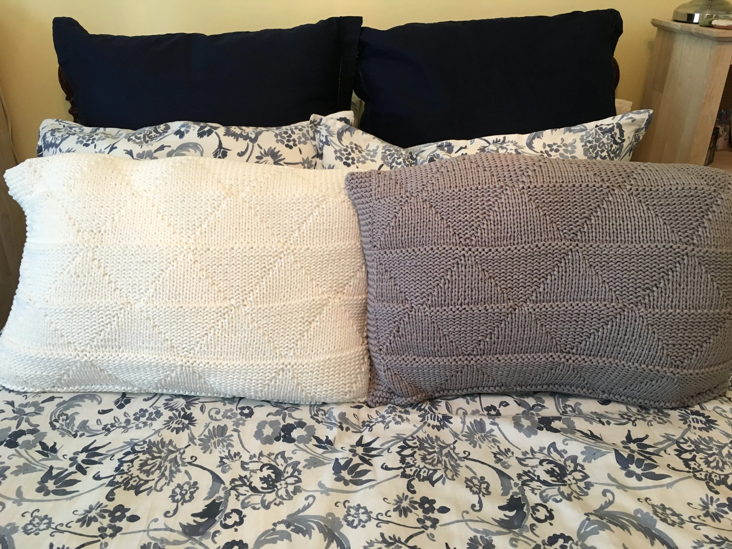 Textured Triangles Pillow This pattern is available for free . Use a standard bed pillow for insert. You’ll love the texture of the triangles AND the way the Strata yarn works up.