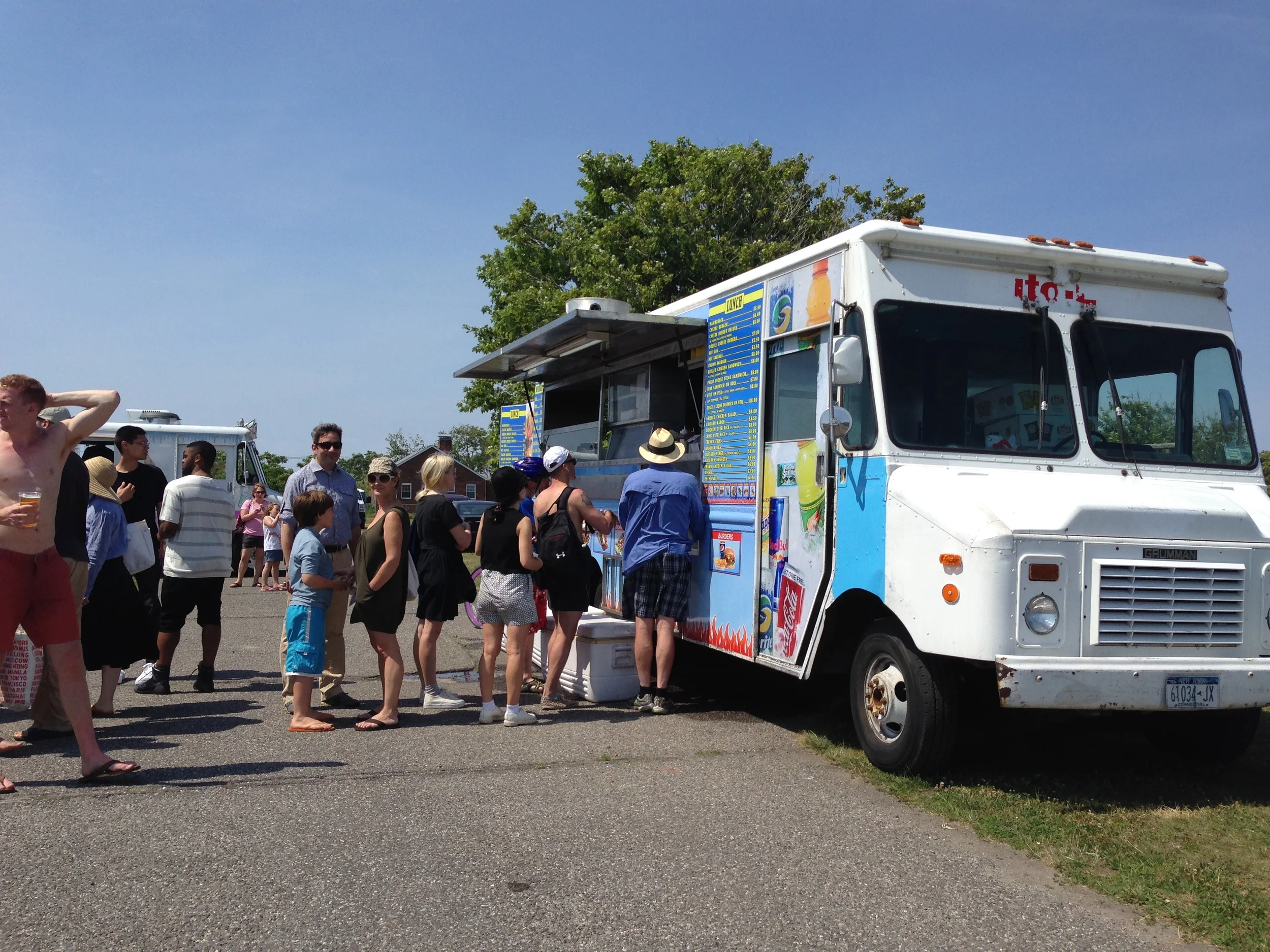 Park goers enjoying the delicacies of the food trucks at the Rockaway! Public Arts Festival in Fort Tilden.
