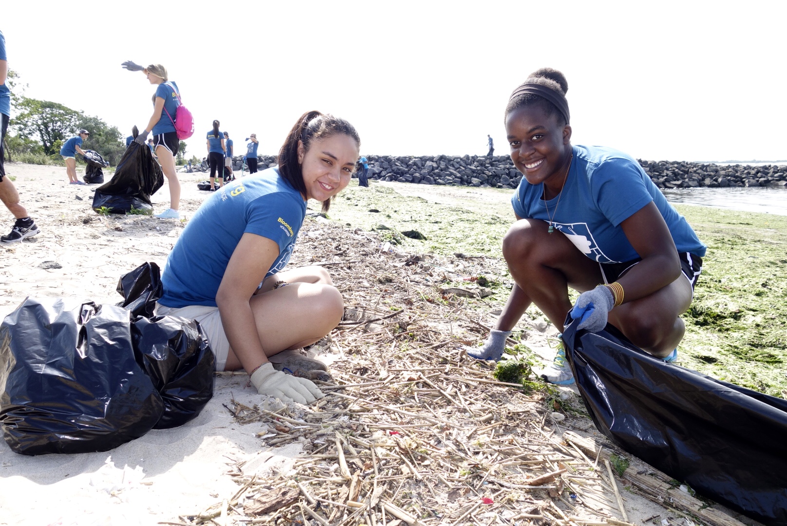  Volunteers remove debris from Plumb Beach. 