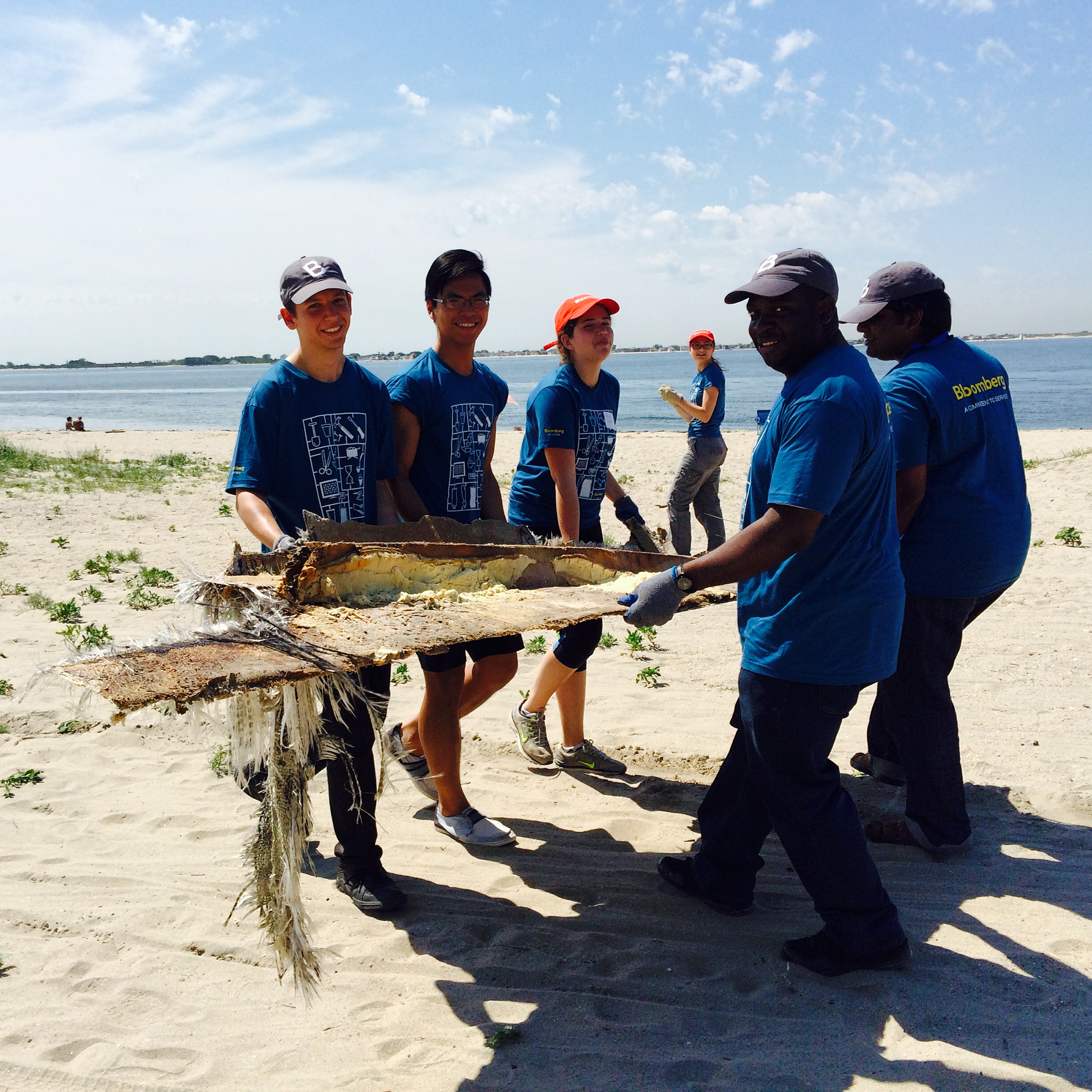  Volunteers remove maritime debris from Plumb Beach. 