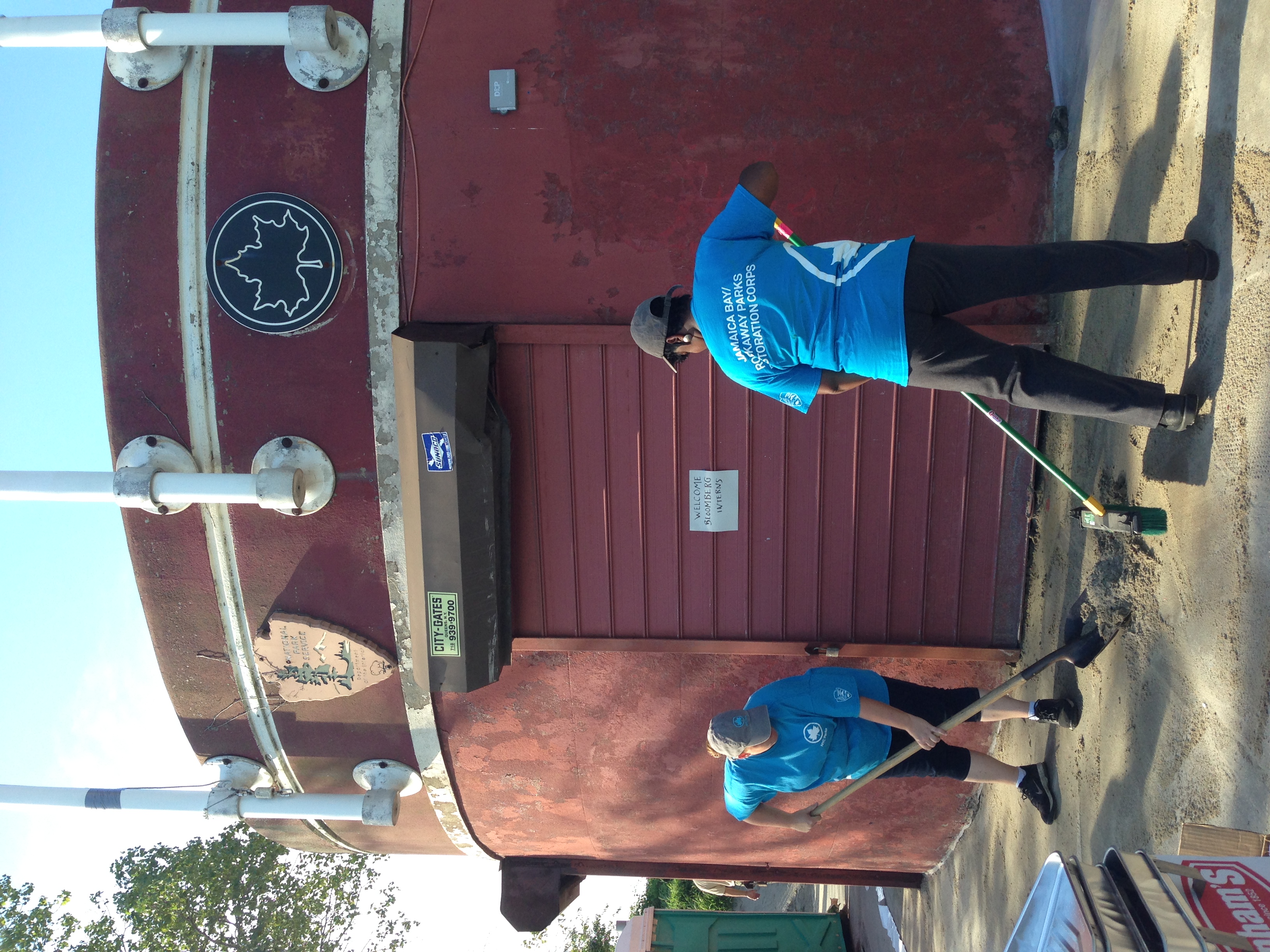  Jamaica Bay-Rockaway Parks Restoration Corps members clean Plumb Beach so that visitors have a safe path to the sand. 