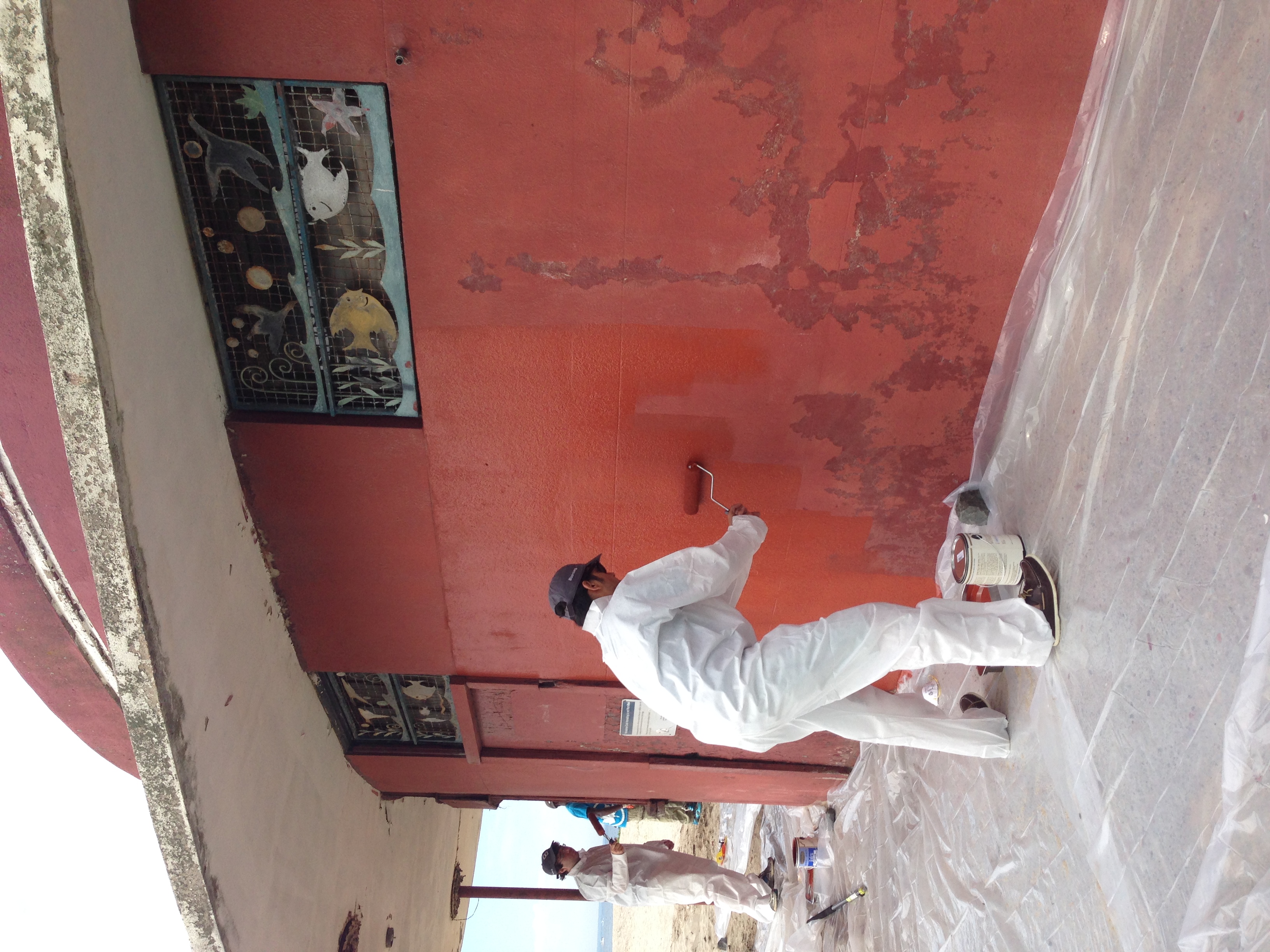  Volunteers coat the Plumb Beach Roundhouse with fresh paint. 