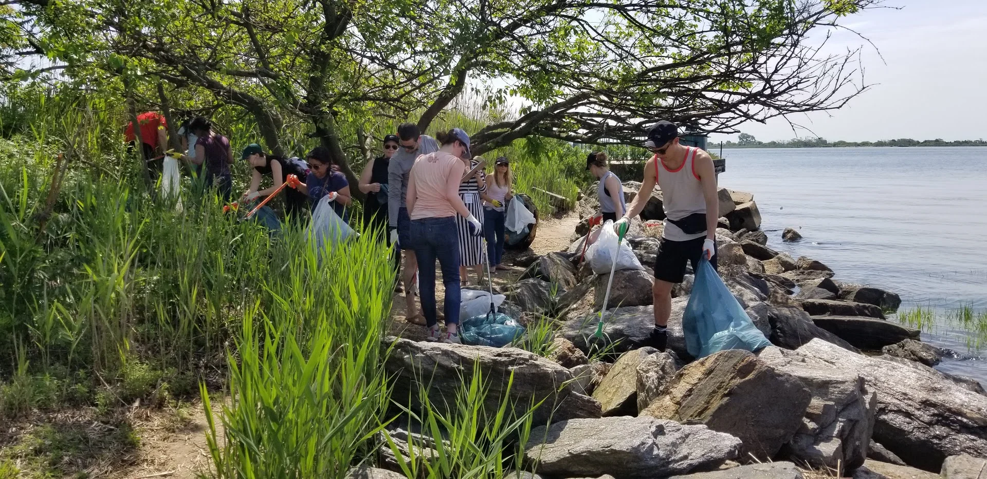 United by Blue volunteers remove trash from Jamaica Bay Park shoreline on Blue Friday, 2018.