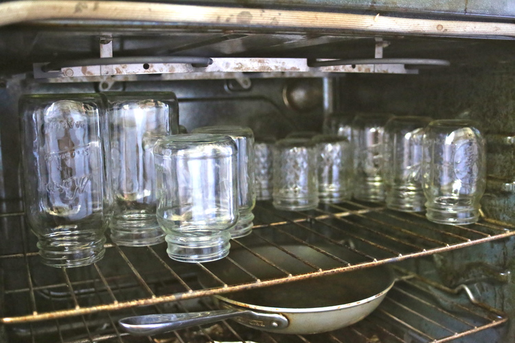 Heating and sterilizing your jars is an important step! You can keep them clean and out of the way by leaving to cool in the oven.