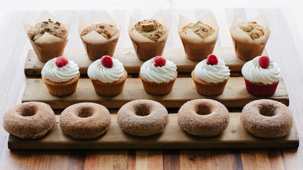 From top to bottom: Pear + ginger, pistachio + chai, blueberry and lemon-poppyseed muffins. Champagne cupcakes. Cinnamon-spice donuts with a vanilla bean with maple glaze.