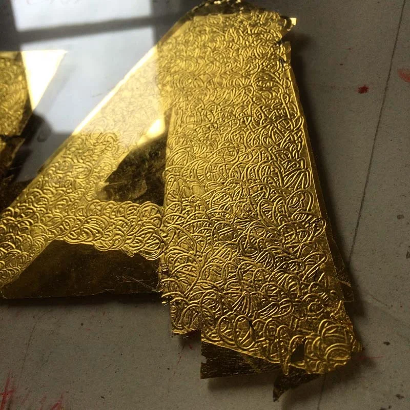 Embossed Gilded Letter