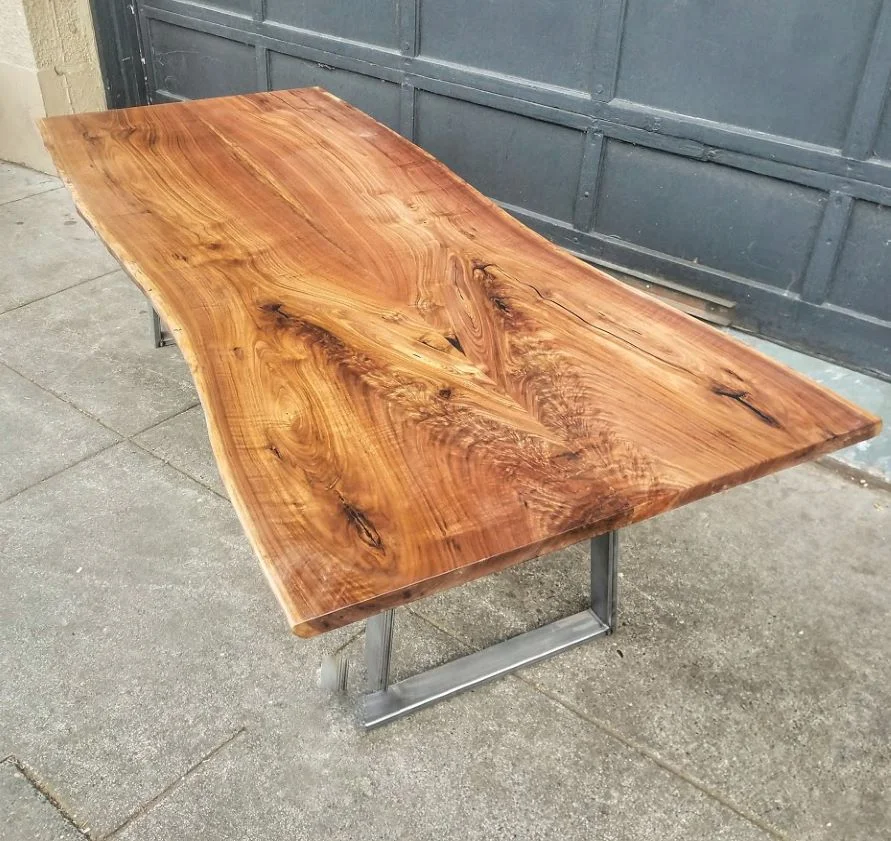 DARK WALNUT BOOKMATCH TABLE 102”x 36-39.5” $4700.00
