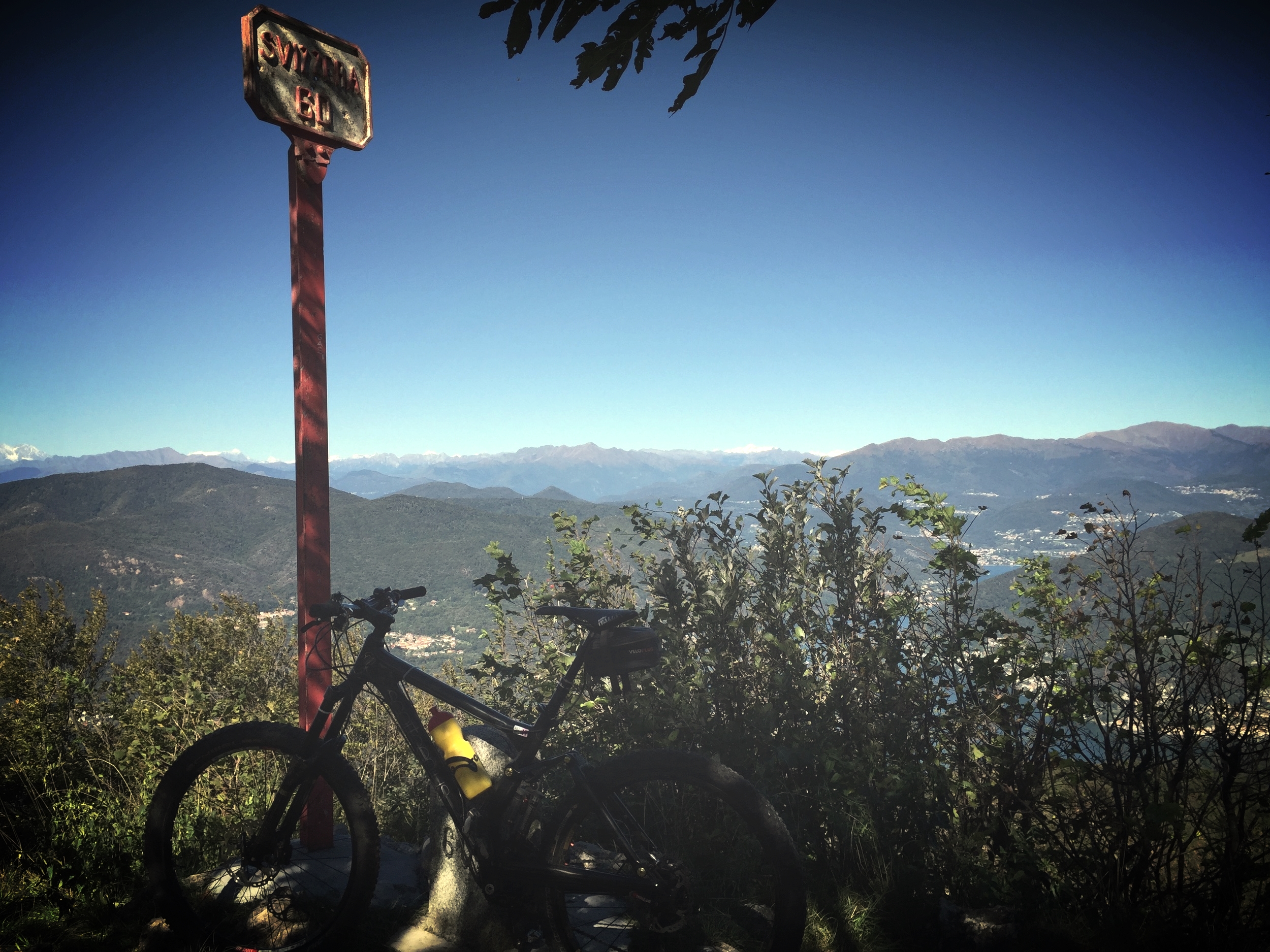  Riding the border. Went on some beautiful mountain bike rides while staying in Porto Ceresio. Literally crossing back and forth between Switzerland and Italy. Signs and clean trails on one side, overgrowth and spray paint on the other (you can guess