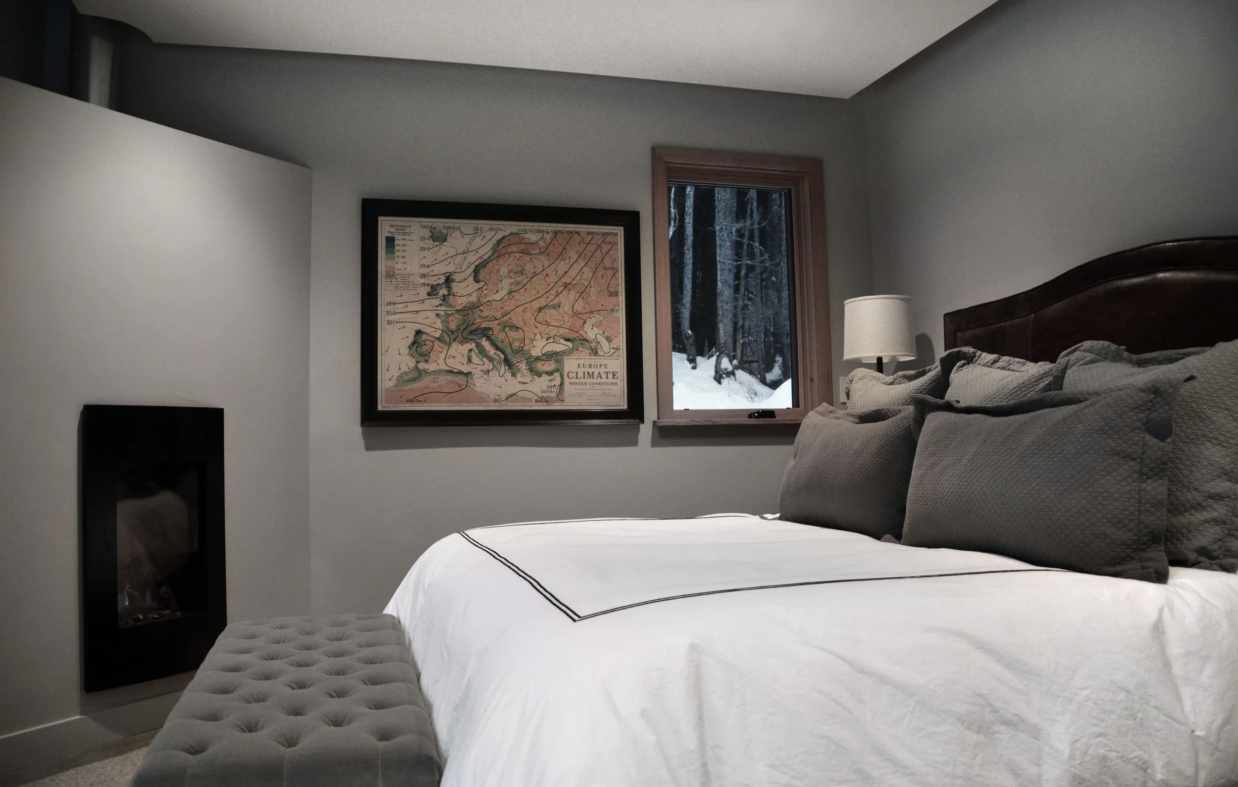 A modern “cabin” in the woods, this vacation home is situated on an isolated piece of property in the resort community of Girdwood, Alaska, located five minutes from the famed Alyeska Ski Resort. Our primary focus was to directly engage the living space with the outdoor setting. A well edited palette of materials creates a calming, rustically modern space that enhances the spectacular views. This vacation home is the ultimate destination for relaxation. What we did: Brought on board early in its development, NMI worked hand-in-hand with Girdwood-based Z Architects to develop the concept, layout, and interior/exterior details. In addition, we led the design direction on space planning and kitchen and bath designs (inclusive of custom cabinetry). The three-year project was a labor of love for NMI, and we continue to work with the clients to select art and refine exterior design elements.
