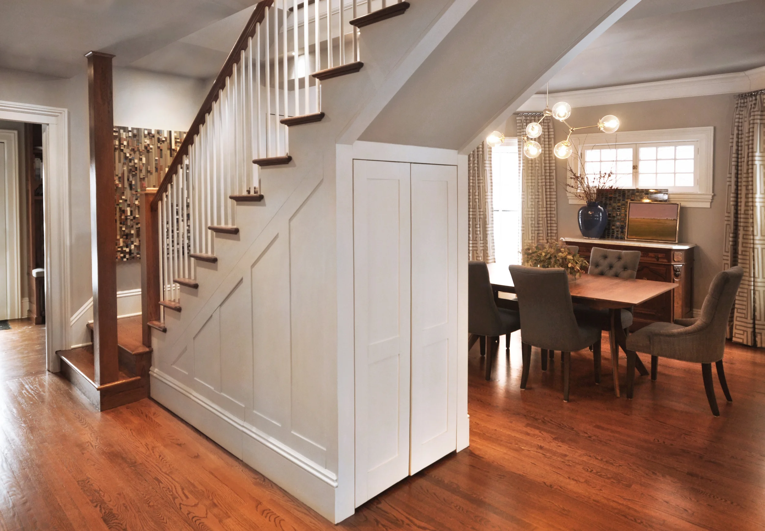What do you do with a historic 1874 single-family home that has great bones but doesn't function properly for the active and entertaining-focused family who inhabits it? We gutted it to the studs, redesigned the layout, created a master bedroom/bathroom suite, and layered back in the historical details that kept the family in the house for over twenty years. Through thoughtful space planning, we were able to take an awkward and dark Victorian layout and transform it into a gracious and light-filled space fit for both hanging out with family and hosting large parties. This project exemplifies how good design can fundamentally transform your day-to-day living standards; the clients have never been happier in their home. What we did: Taking the baton from the original project architect after logistical challenges arose, NMI re-oriented the living spaces and bedrooms, designed a new spa-like master bath for the upper level, relocated the staircase to improve traffic flow and brought in a structural engineering team to shore up structural deficiencies in the basement. We also implemented a full space plan, selected a broad mix of contemporary, custom, and transitional furniture to compliment the client’s historic antiques (all of which were restored for the new space) and assisted the clients in curating a new contemporary art collection to juxtapose the traditional and transitional elements of the home. 