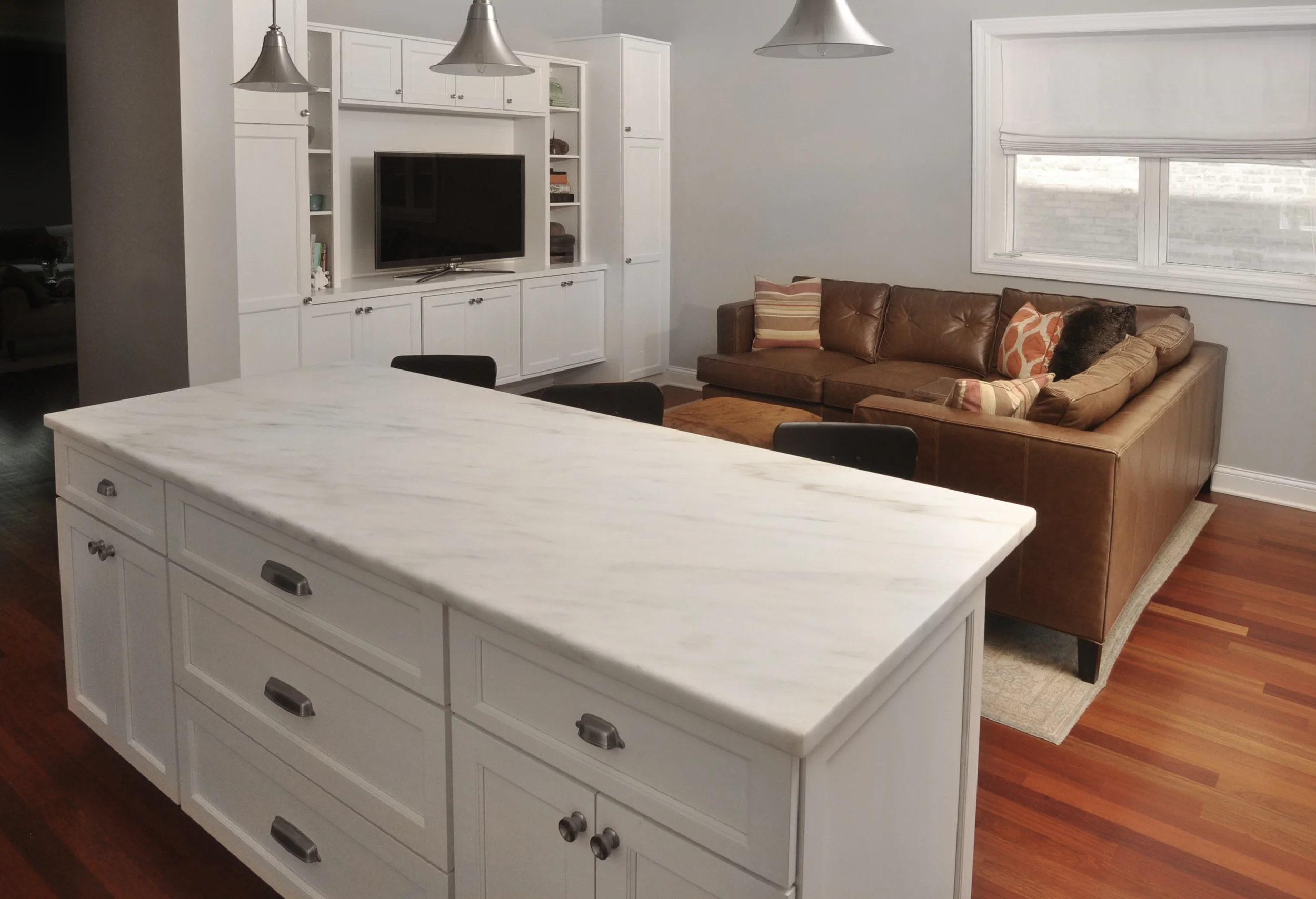 In order to meet the multi-functional needs of this active family we redesigned the flow of the main living area of their home inclusive of moving the kitchen from one side of the house to the other. Through thoughtful space planning we were able to fundamentally change the feel of the main living space. A once disconnected and dark kitchen is now a prominent and purpose-filled feature in the house thus allowing the family to be fully engaged with the heart of their home. What we did: NMI was hired to redesign the kitchen and living areas of this home. Through our initial planning exercises we realized that the optimal solution for this family included completely moving the kitchen. We produced all necessary construction documents, structural plan reviews, and construction management. In addition, we implemented space plans throughout the first floor and redesigned the basement living area. 
