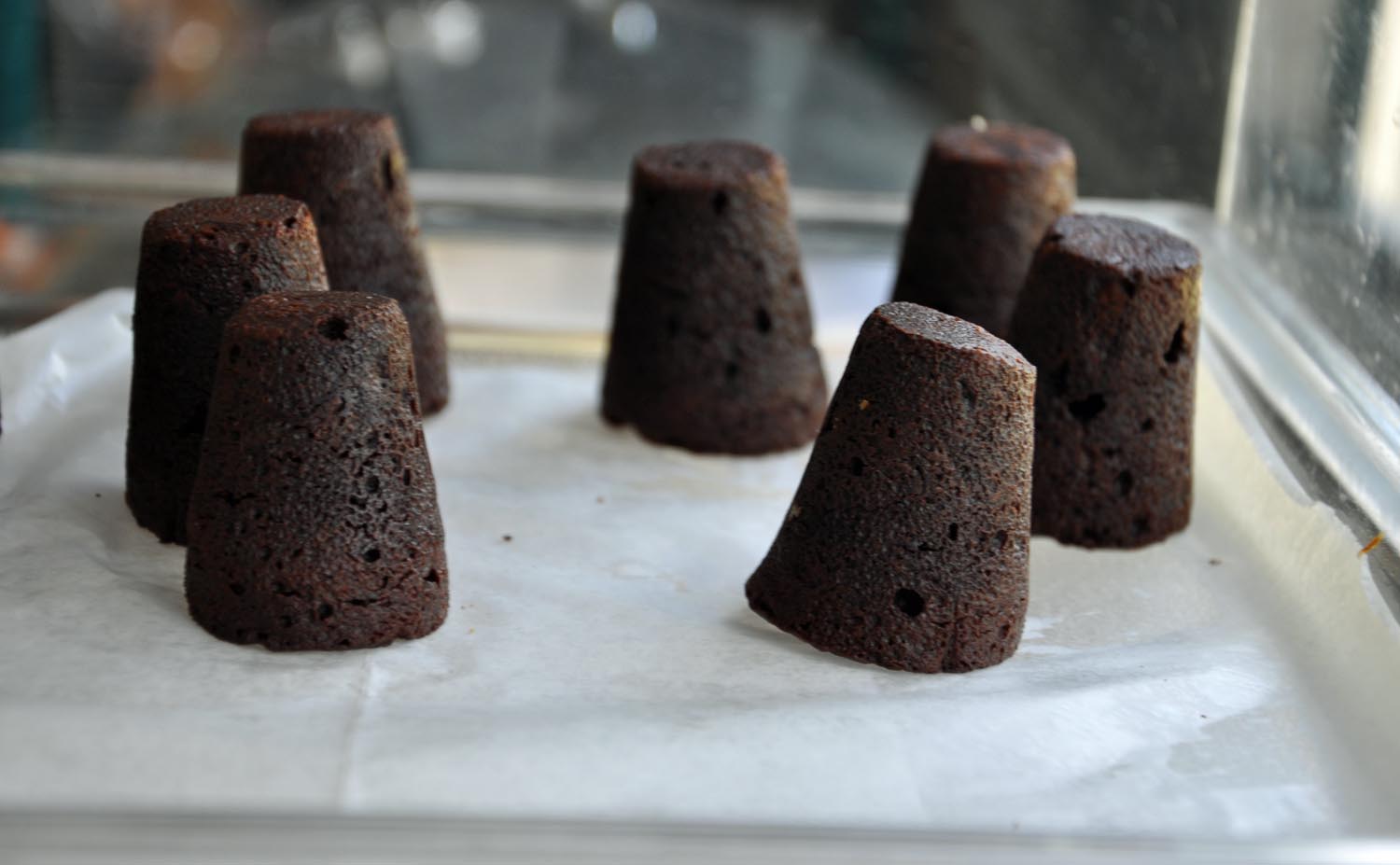 BOUCHON - A DELICIOUS CHOCOLATE PASTRY NAMED IN FRENCH AFTER THEIR CORK-LIKE SHAPE. MADE WITH BITTERSWEET CALEBAUT CHOCOLATE, THESE PRETTY TREATS ARE PERFECT ON A SCOOP OF ICE CREAM, DUSTED WITH POWDERED SUGAR AND PAIRED WITH COFFEE OR MILK, A GLASS OF RED WINE, OR SIMPLY ENJOYED ON THEIR OWN. 