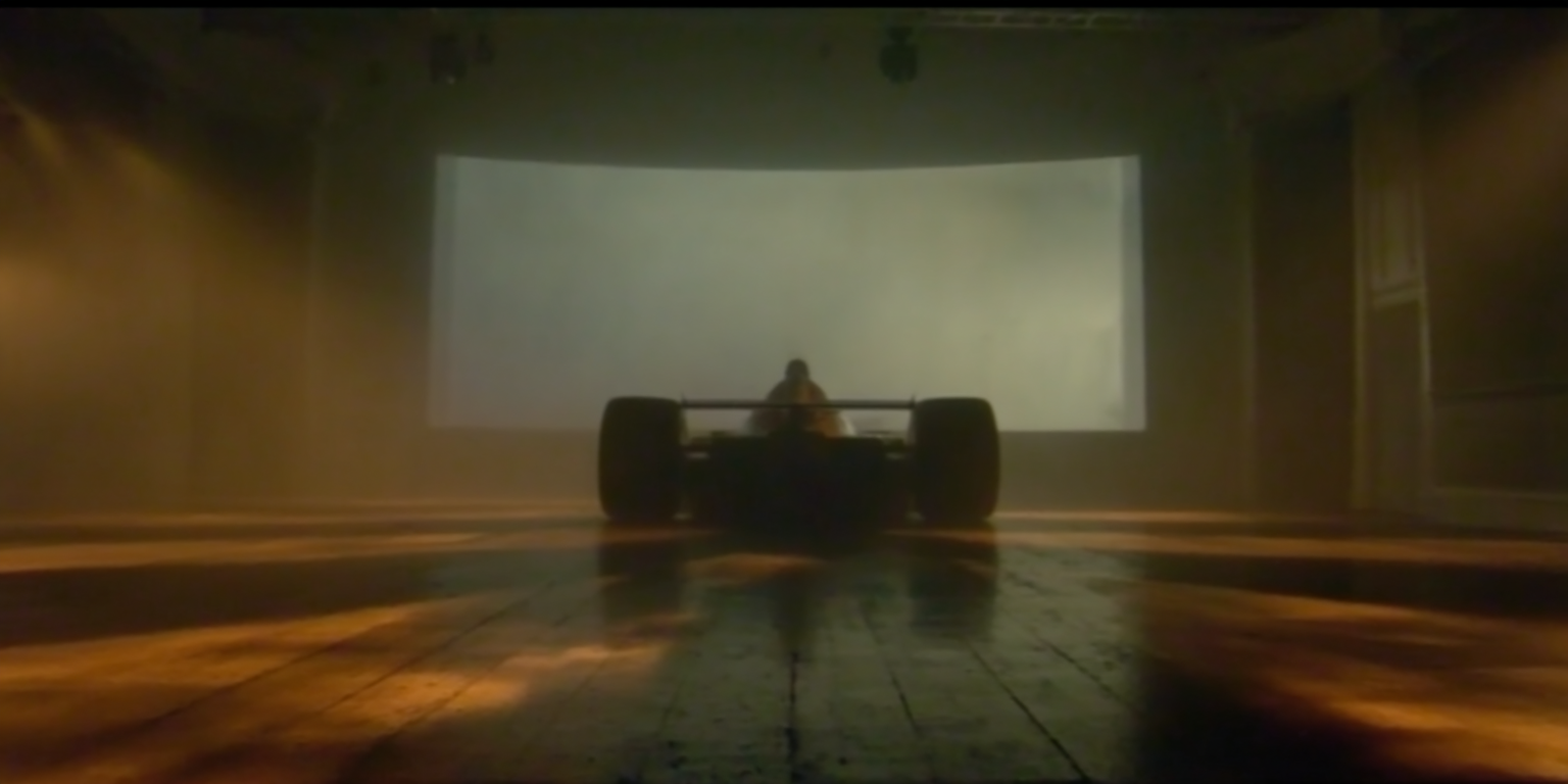 u1146626773_A_dark_room_with_a_glowing_white_projection_scree_85a90c69-b327-44b2-9e50-0dc4df041f7b_3.png