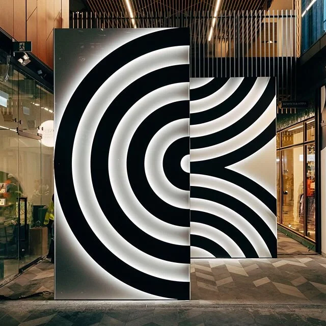 This time last week we were installing this illuminated feature we created for @commercial_bay and their VIP preview evening . Two 4m high walls with CNC cut satin black detail. Backlit with a neutral white LED. Stoked to be apart of such a great event with @thejellyologist &amp; @bexworld - and an amazing new addition to the city! 📸 @lukefmphotography  #leds #commercialbay  #featurewall #temporary #cnc #lightart