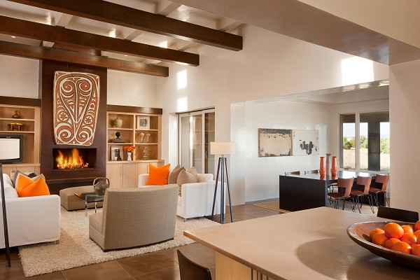 Over the fireplace is a New Guinea shield from the 1920's. The sofas are Burton James with locally made slip covers. The dining table was designed by Violante & Rochford and made of solid metal by a local Santa Fe craftsman Mike Schreiber. The coffee table is Knoll.