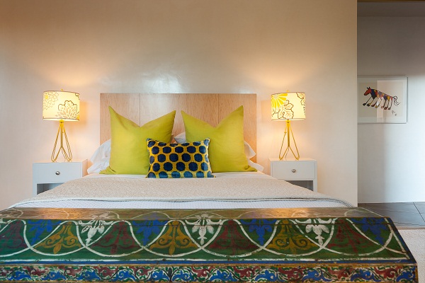 At the foot of the bed in the guest bedroom is an antique Moroccan chest from the mid 1800's. The lamps were sourced from Design Warehouse in Santa Fe, NM