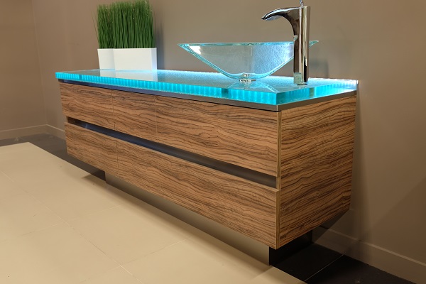 This kitchen also features a custom glass counter/sink area situated to the right of the countertop & island.