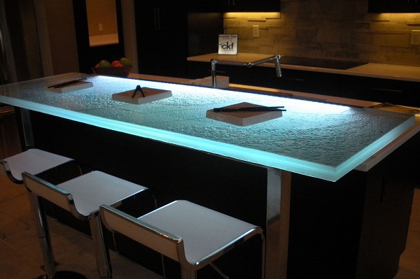 Another look at the same raised bar countertop seen above with lights dimmed and LED lighting on