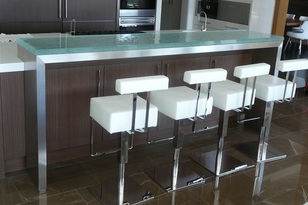 The above raised glass countertop is a “substrate” raised countertop that using a stainless steel substrate that also extends to the floor. 