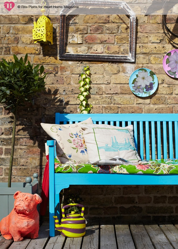 A bright splash of colour and some cosy textiles makes this seating nook sing.