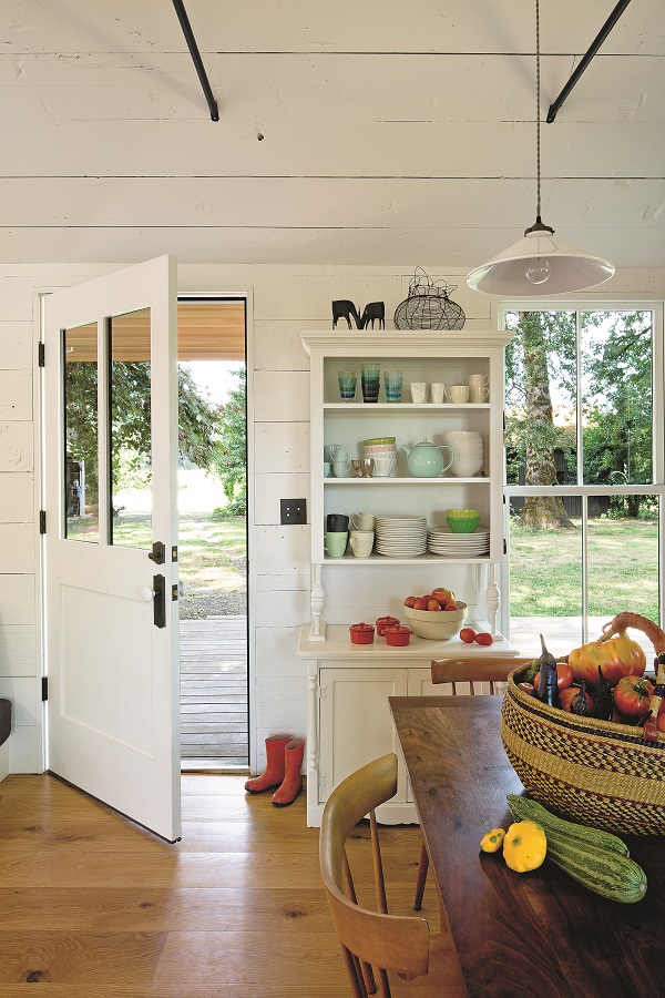 The walls were insulated, then faced in reclaimed wood siding from a barn that had been deconstructed onsite.