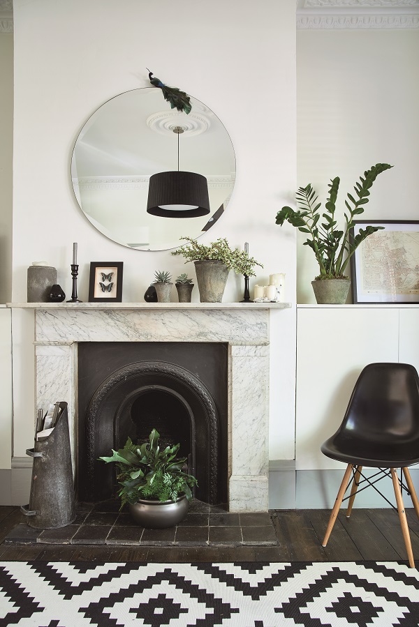 Houseplants are interspersed with favourite ornaments for a more personal display.