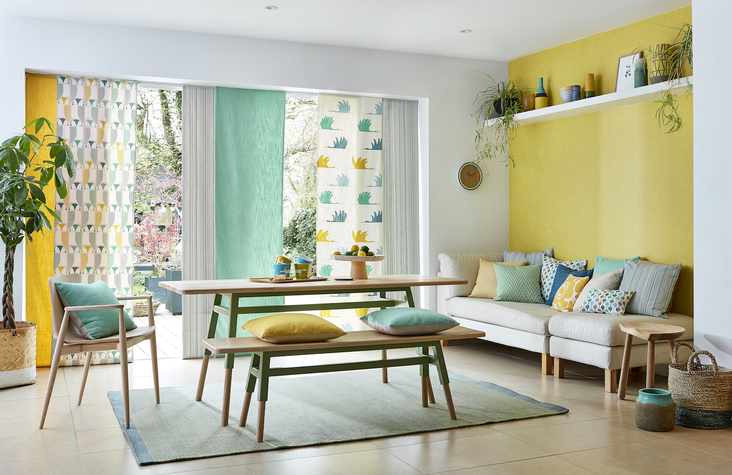 Fabric panels left to right: Barnie Owl, Rivi, Colin Crane, Rivi - £30/£35 / metre; Wallpaper: Votna, Saffron - £39 / roll. Cushion: A selection of fabric from Pepino