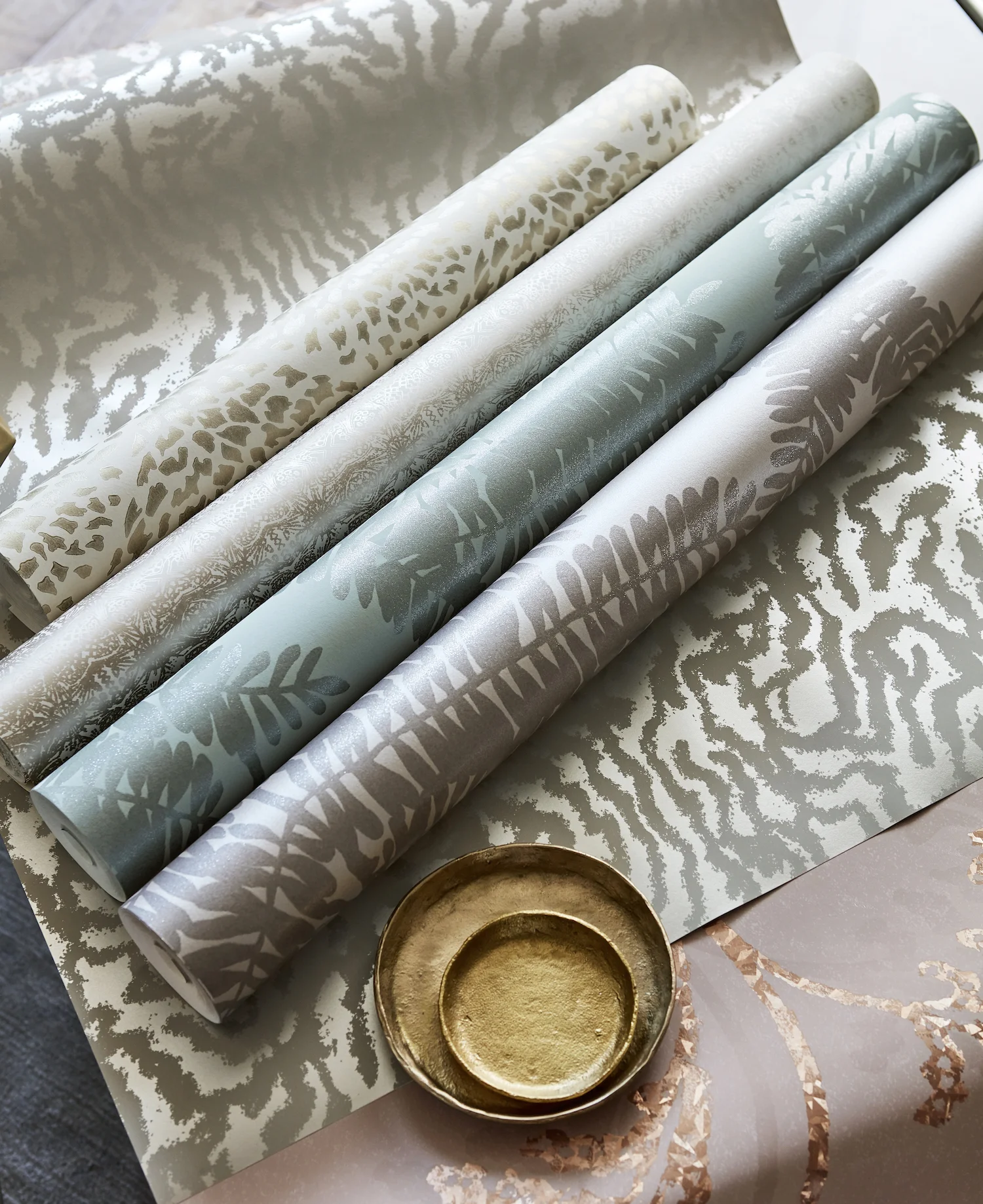 Curtain: Azurea - £50 per m, Sofa: Momentum Etch - £55 per m, Cushions (L-R): Azurea - £50 per m, Seduire - £60 per m.