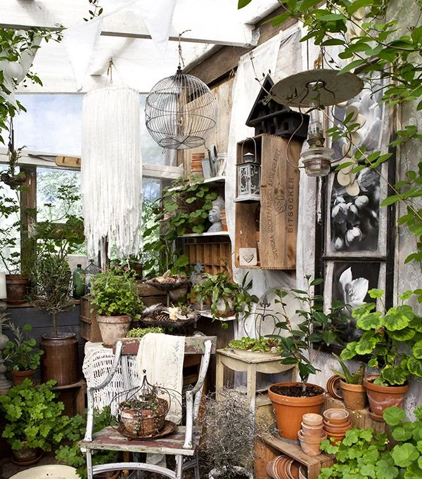 Terracotta pots, crate storage, rustic birdhouses and vintage lanterns transform a potting shed corner into a country gardener’s retreat. Shed Decor by Sally Coulthard is published by Jacqui Small Publishing . 