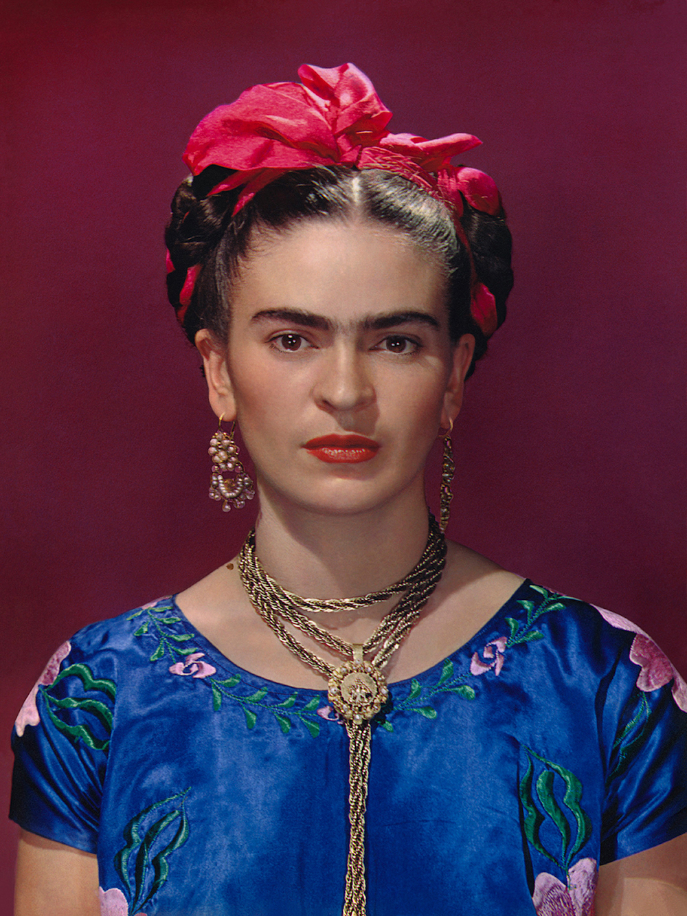 Frida Kahlo in blue satin blouse, 1939, photograph by Nickolas Muray © Nickolas Muray Photo Archives
