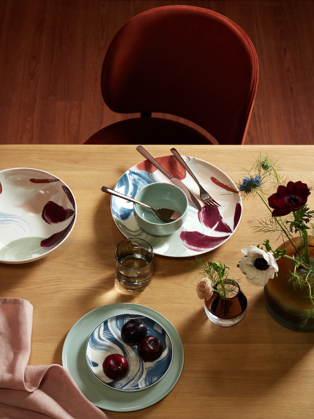 John Lewis & Partners Santino 8-10 Seater Extending Dining Table, Solid Oak, £899; Design Project By John Lewis No.203 Upholstered Side Chair, £299; Broste Copenhagen Hune Cutlery set, Rose Gold, 16 piece, £175; Mezzo Navy Napkin Set of 4, £12; 3 Tone Glass Multi Small, £40; John Lewis & Partners Impressions China, £7 Side plate green, £7; John Lewis & Partners Impressions China Platter multi, £18; John Lewis & Partners L Impressions China Serve bowl multi, £22; John Lewis & Partners Impressions China Dinner plate Green, £7