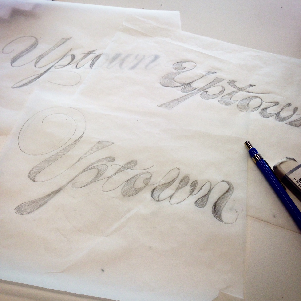 Lettering the word Uptown in many different styles of script. 