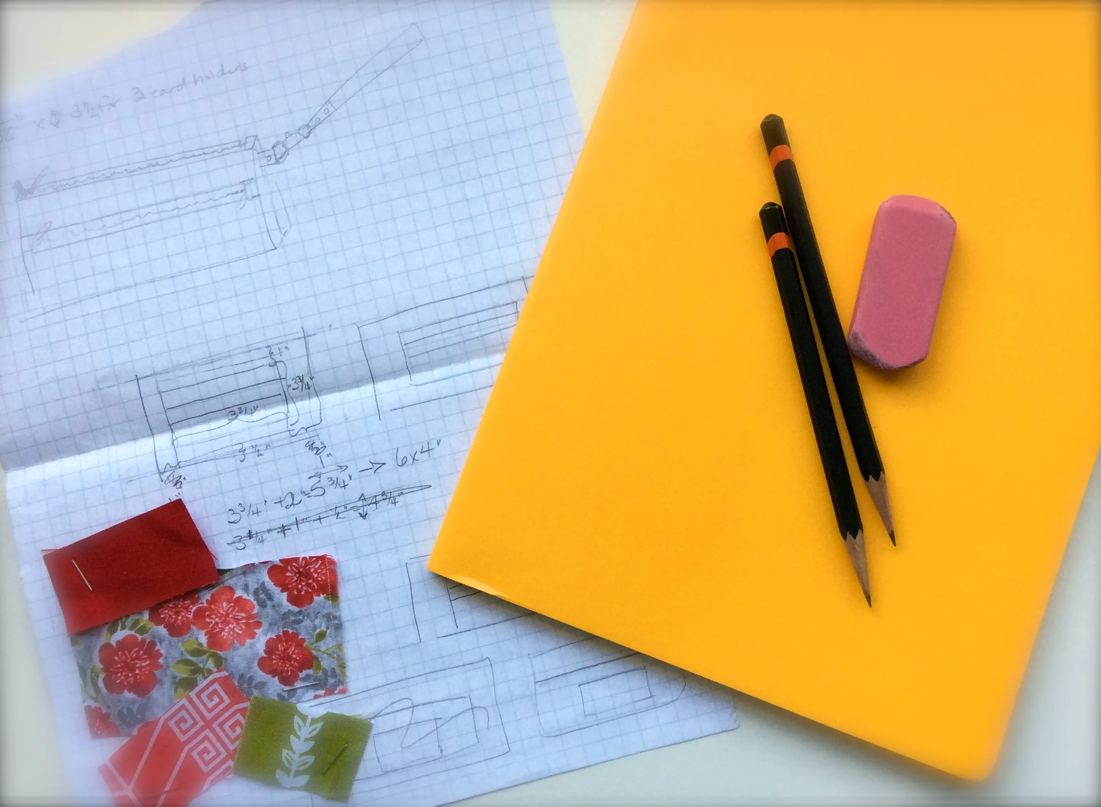 A page from my graph paper sketchbook when I was designing my first bag pattern, and my new, bright yellow sketchbook!