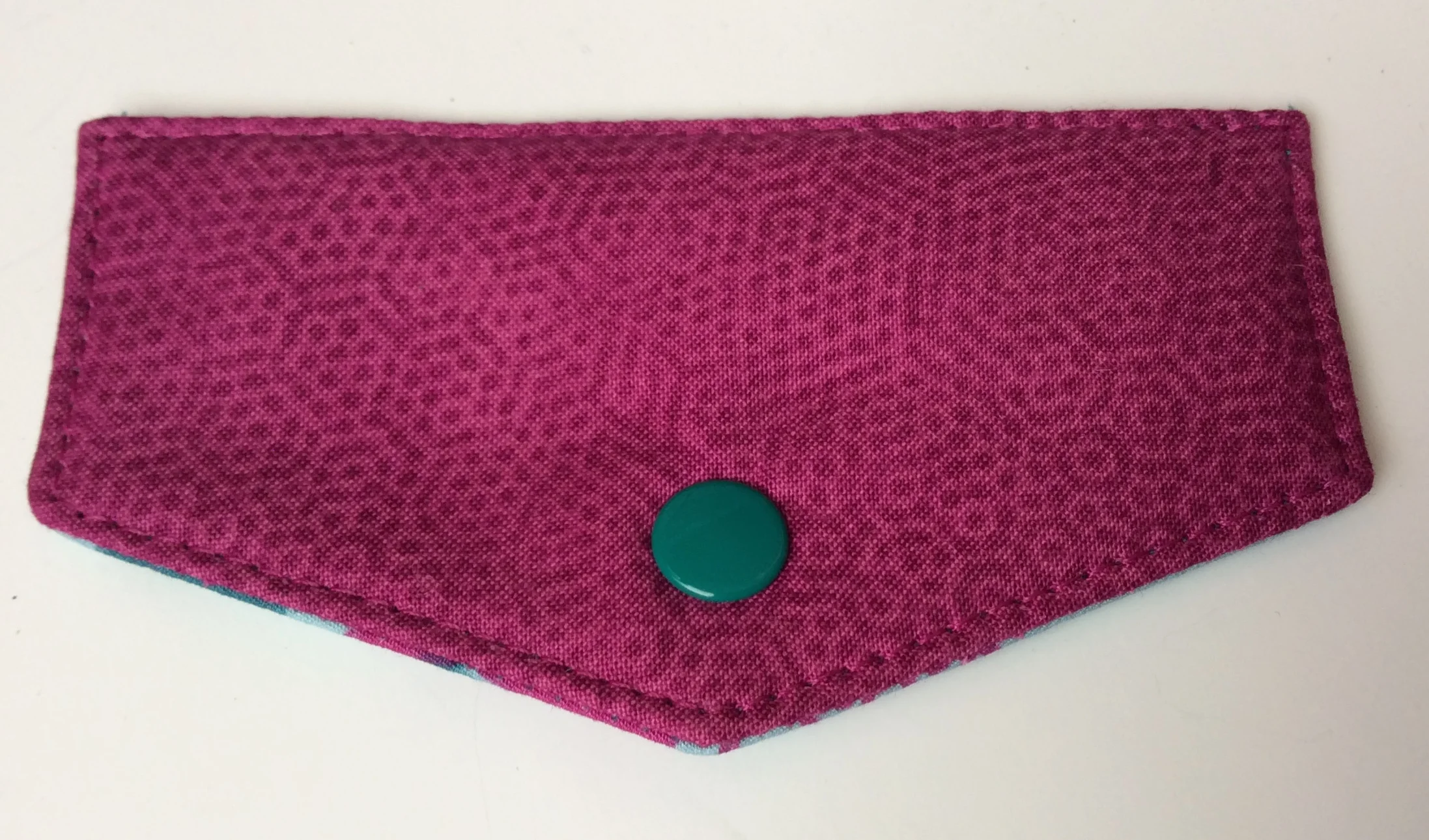 . . . the snap is in place! I love the color of this snap because it brings out the lining color!