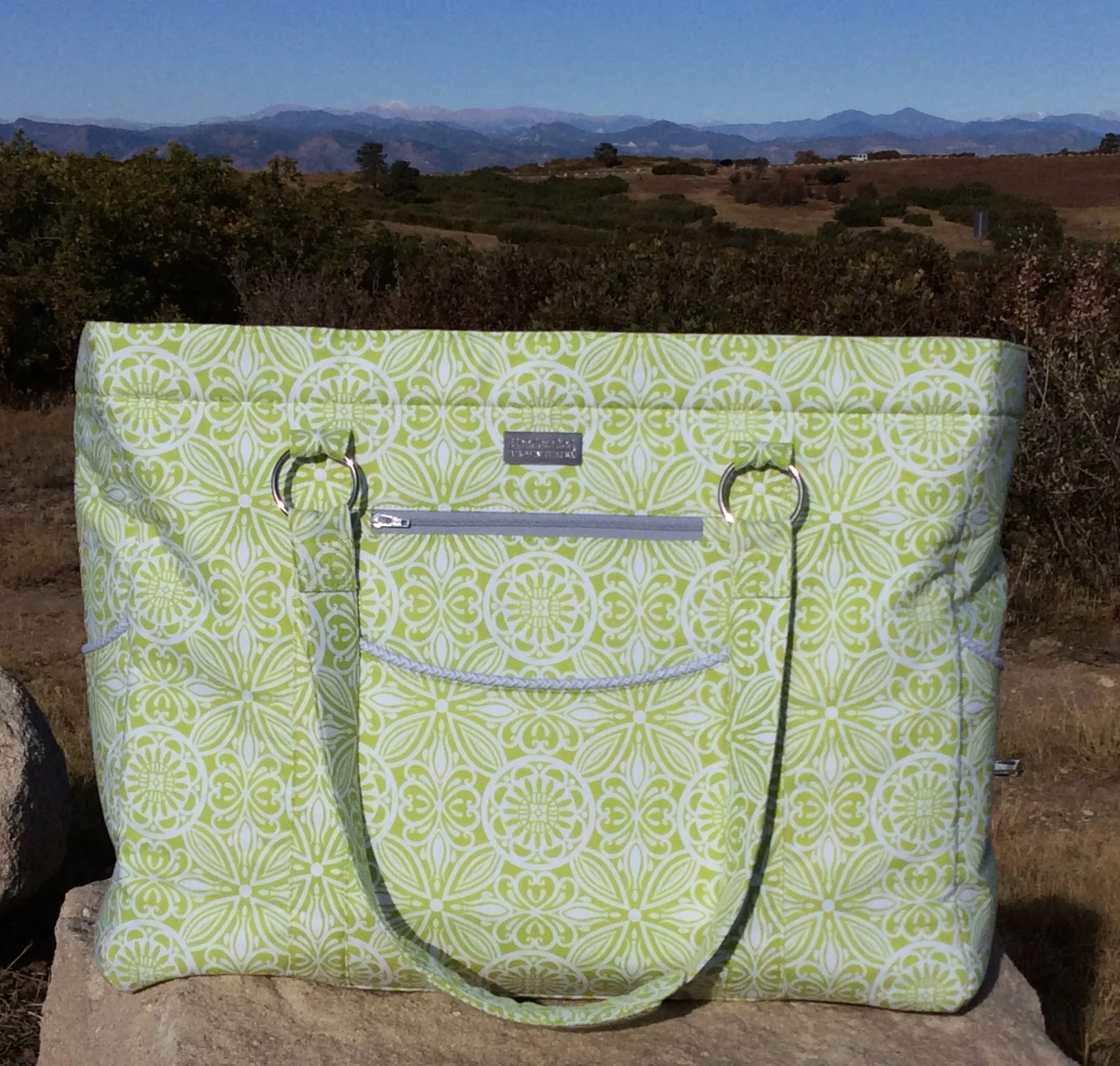 I think those mountains behind this Megan Travel Tote are calling! I think they are calling me! This pattern was a huge undertaking, so I might just have to pack up for a weekend getaway! ;)