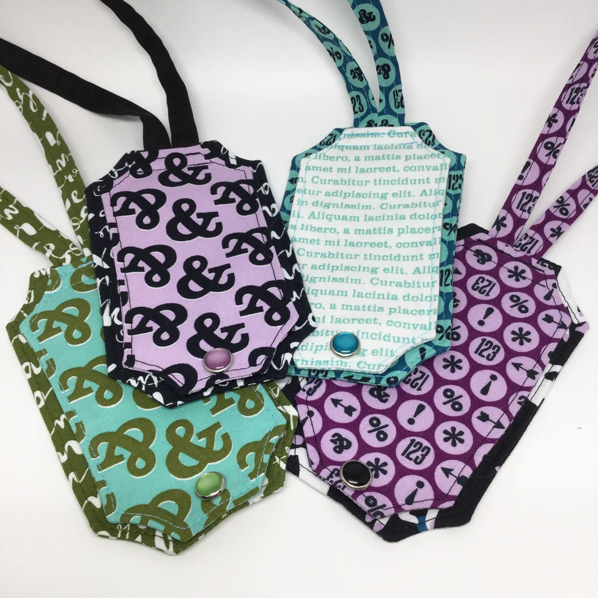 I love how the snaps coordinate so well with the Typography fabric prints!