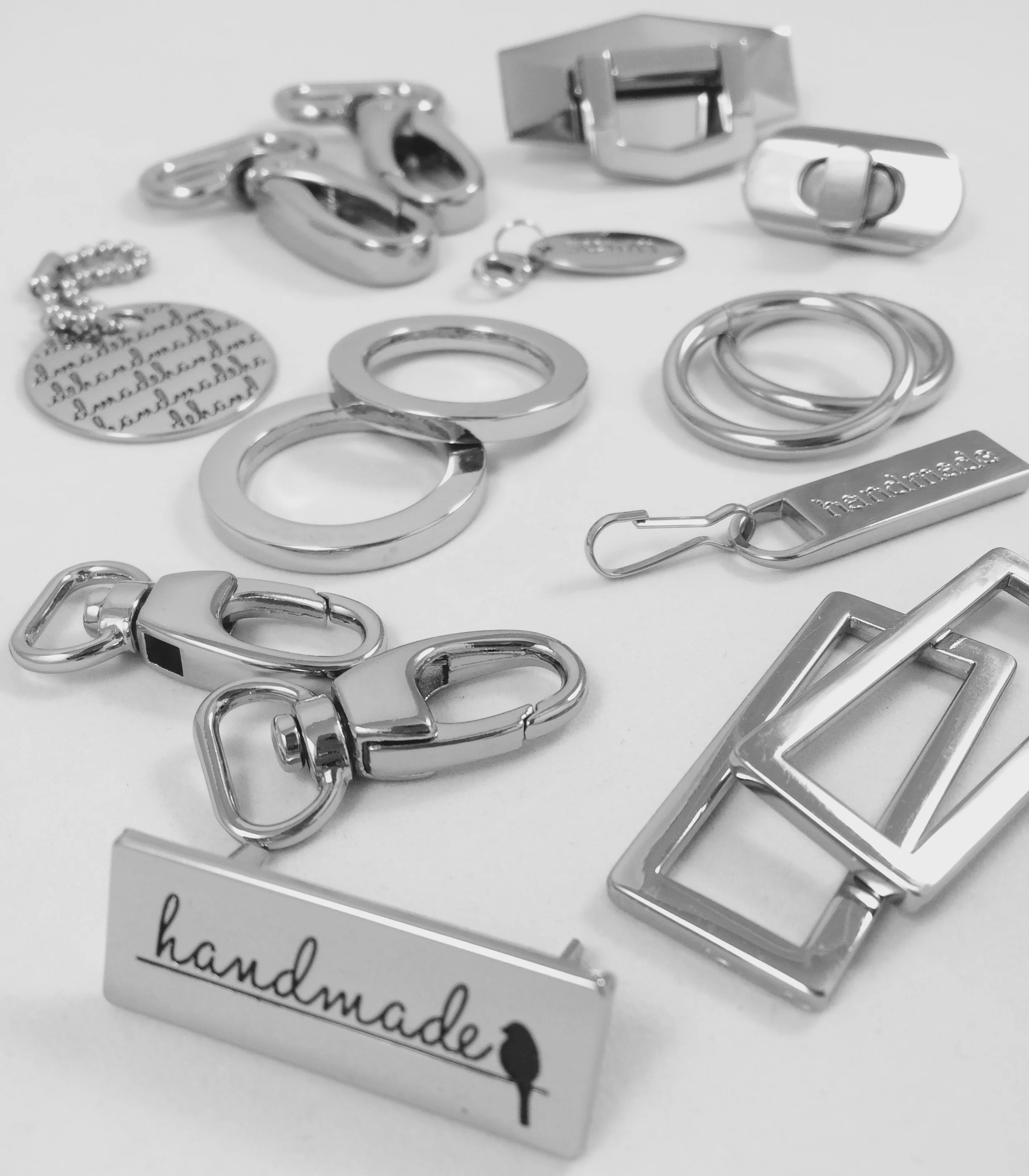 Look at all the pretties! I get most of my hardware from Emmaline Bags .
