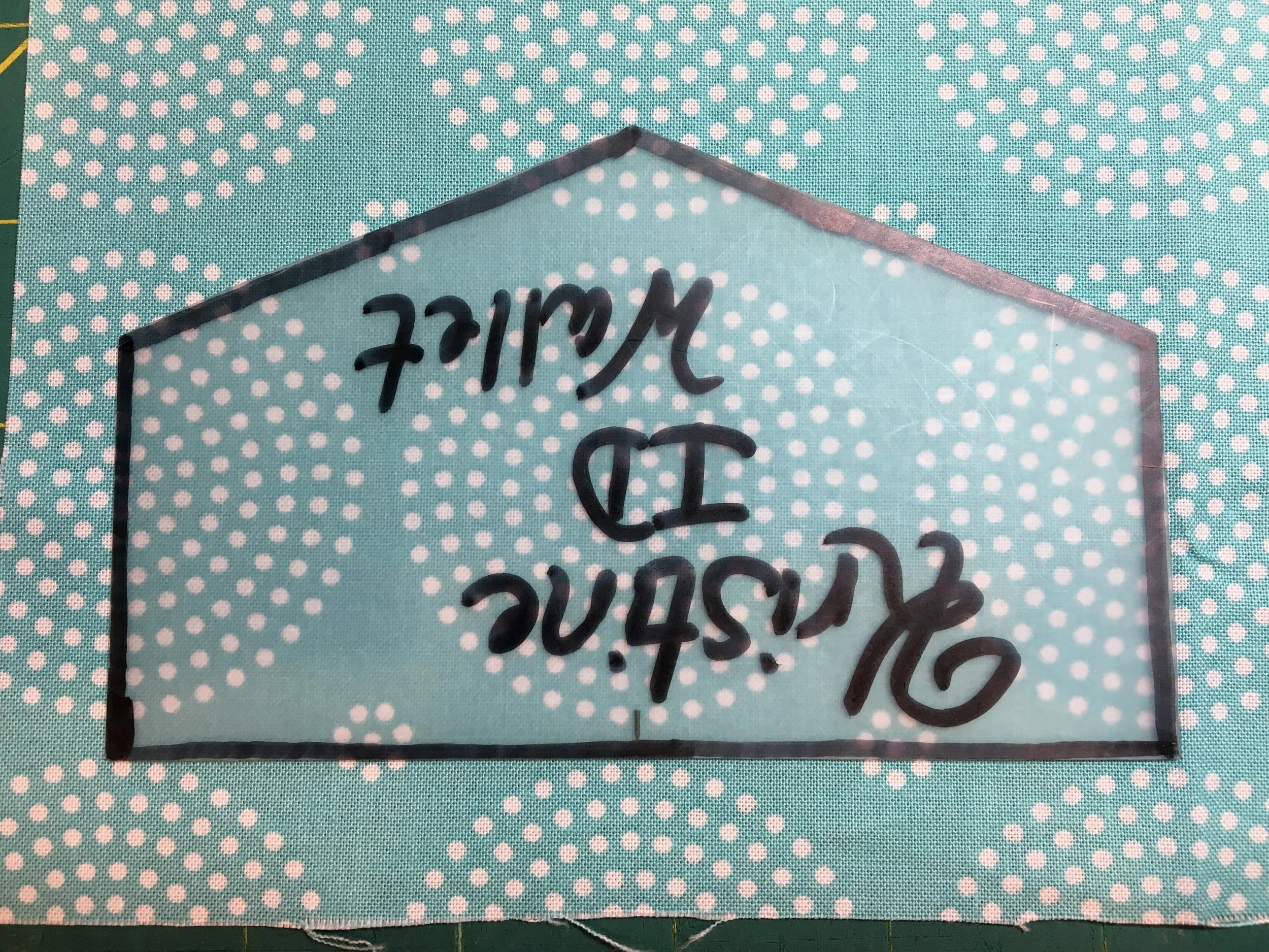 . . . when I am cutting my lining fabric, I position my flap pattern piece upside down. No, this is not directional fabric, so it doesn't make any difference, but I thought a visual would help us remember to do this! ;)