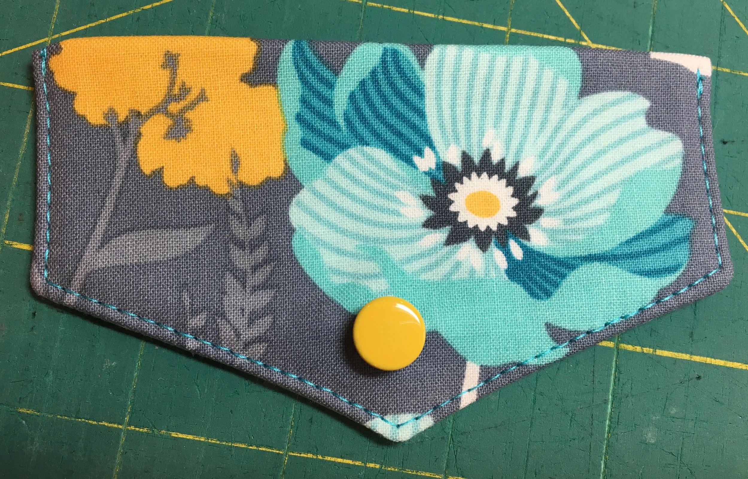 I installed a magnetic snap on this Kristine ID Wallet flap, but you can see what I mean about installing the male half of the snap through all layers if you have a pretty snap that you want to show off. 