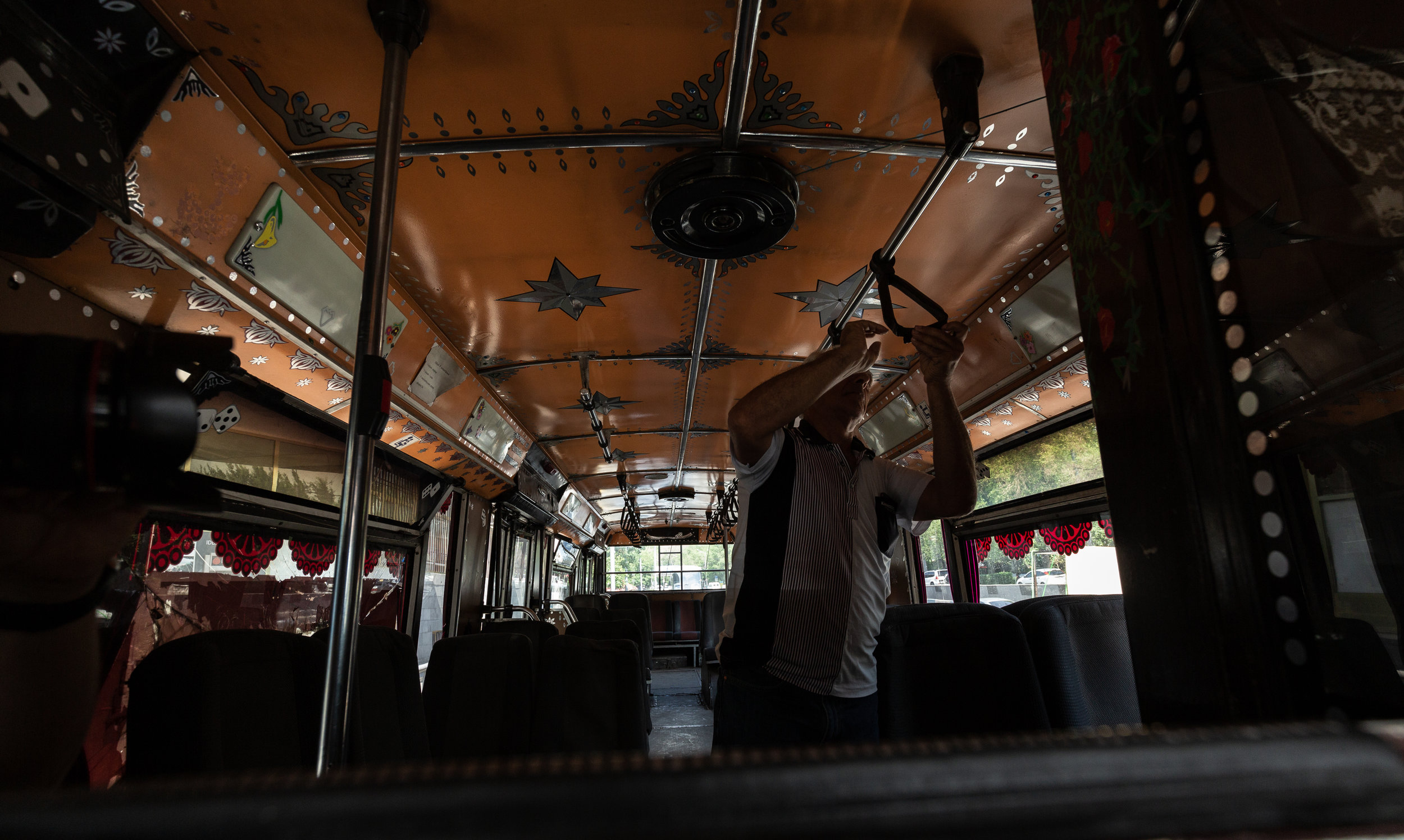 Drivers usually use their free time in-between routes to make repairs on their buses both mechanically and cosmetically. 