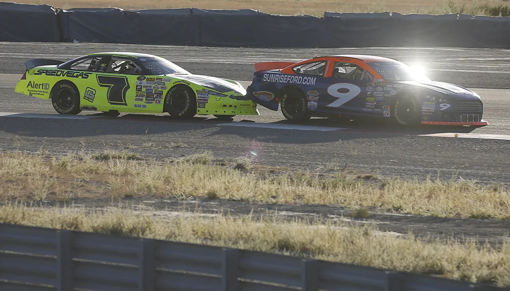 Noah Gragson gets underneath Ryan Partridge en route to sweeping the road course doubleheader in September at Utah Motorsports Park. Jim Urquhart/NASCAR via Getty Images