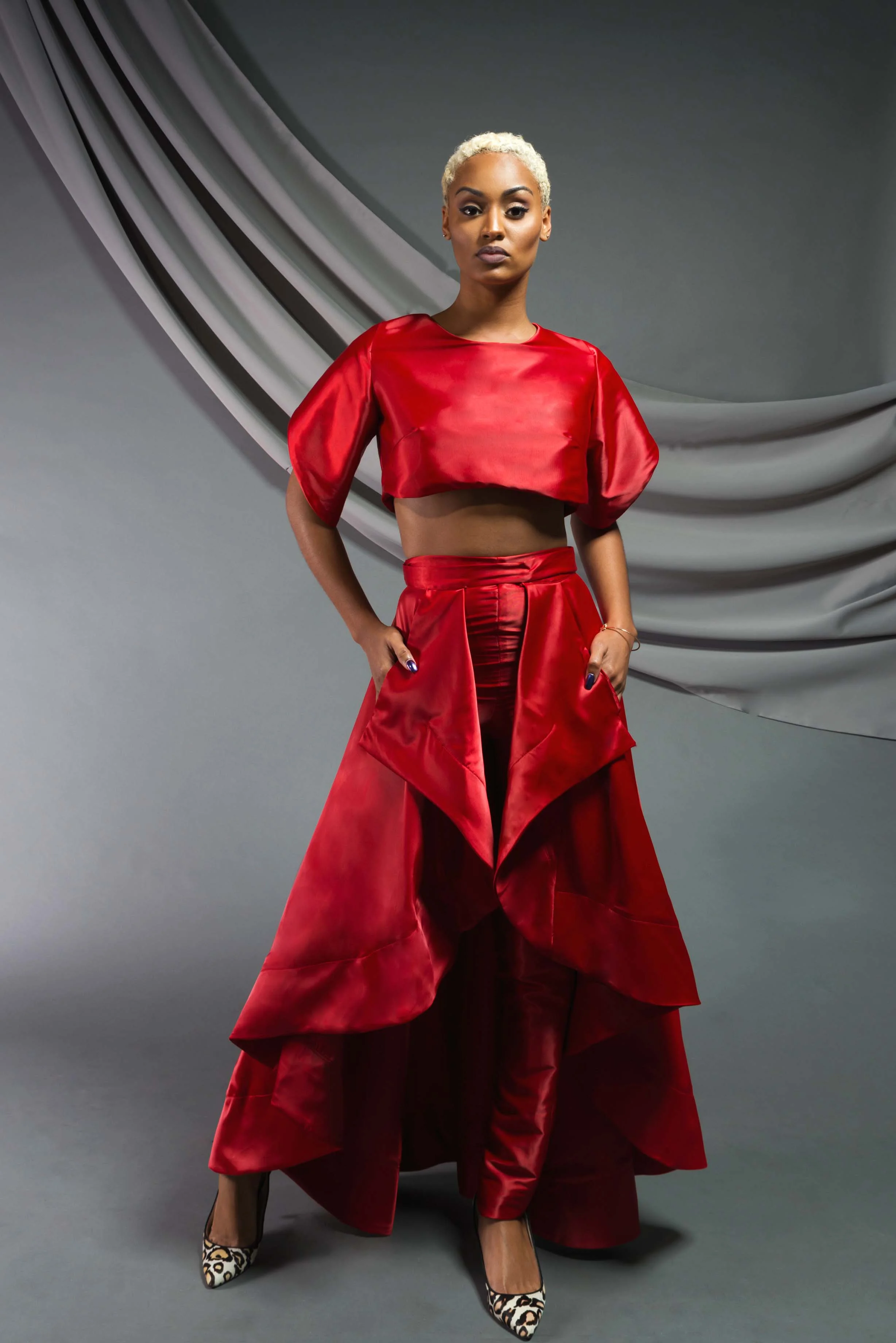 Petal Sleeve Crop Top: Stretch satin charmeuse Open-front Skirt: Stretch satin charmeuse High-waist Cigarette Pant: Stretch satin charmeuse 