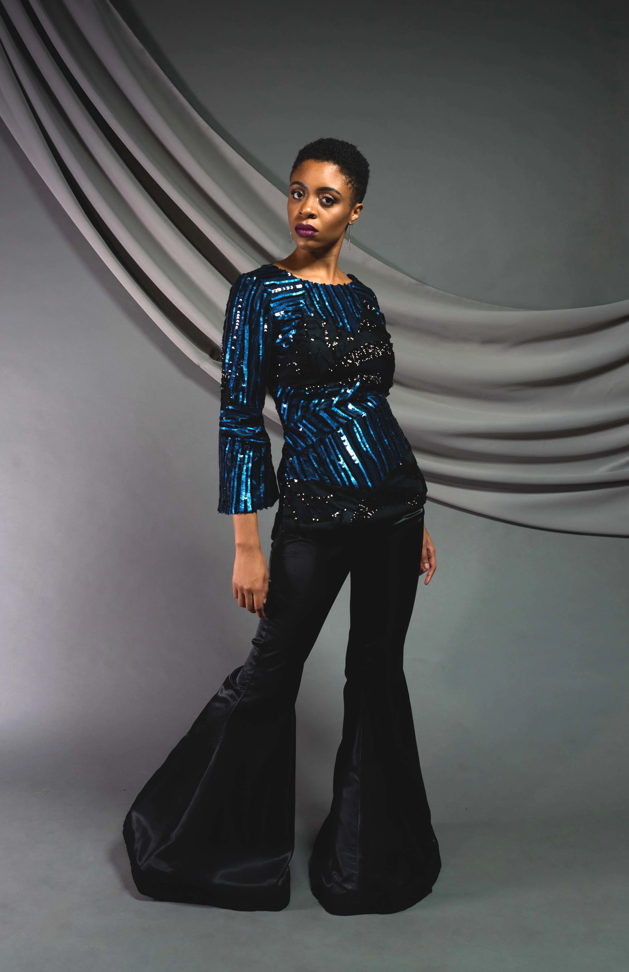 Sequin Tunic: Sequin mesh, fully lined Bell bottoms: Silk shantung