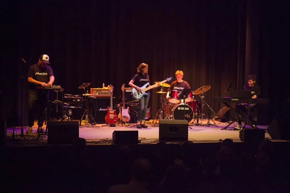 Faculty member Stu accompanies the Teen Jazz & Blues Ensemble on the Strand stage at a recent recital.