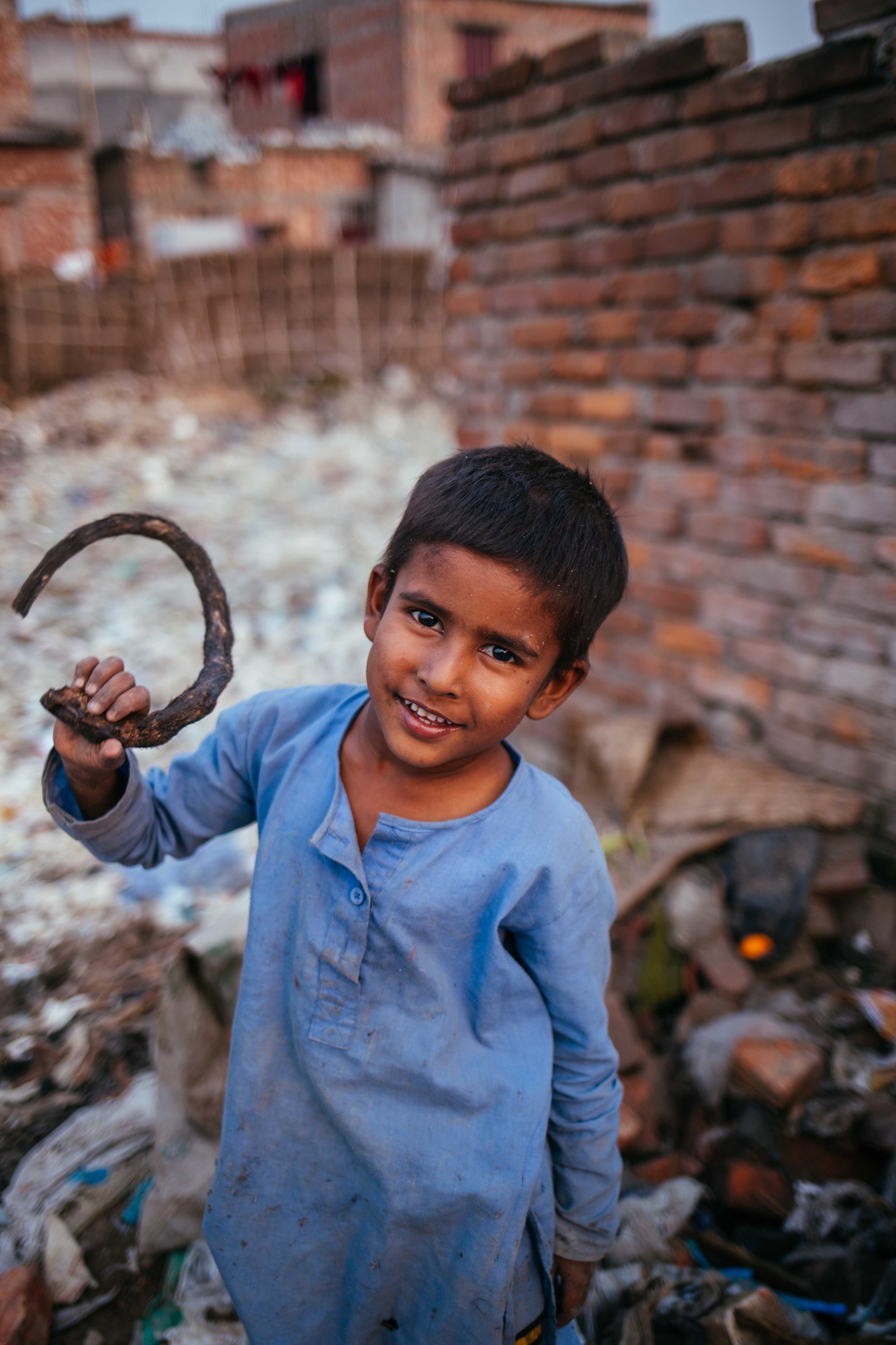  Rohnee, aged 7, rumages through piles of leather and bags of animal parts to collect horns from the carcasses of animals used for hides. He sells these to shops which will make jewellery and furniture from them.&nbsp;Should the tanneries move,&nbsp;