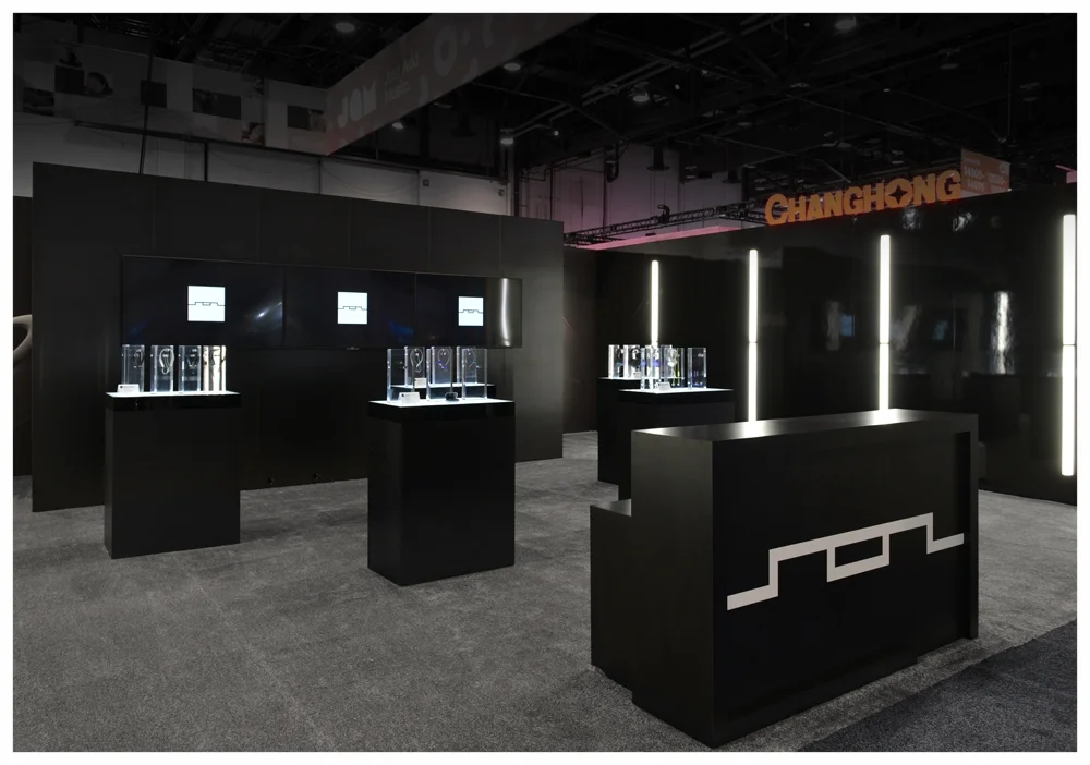 The video was displayed across three monitors and was the visual centerpiece of the SOL Republic booth.